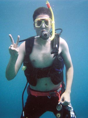 Me, giving the peace sign underwater
